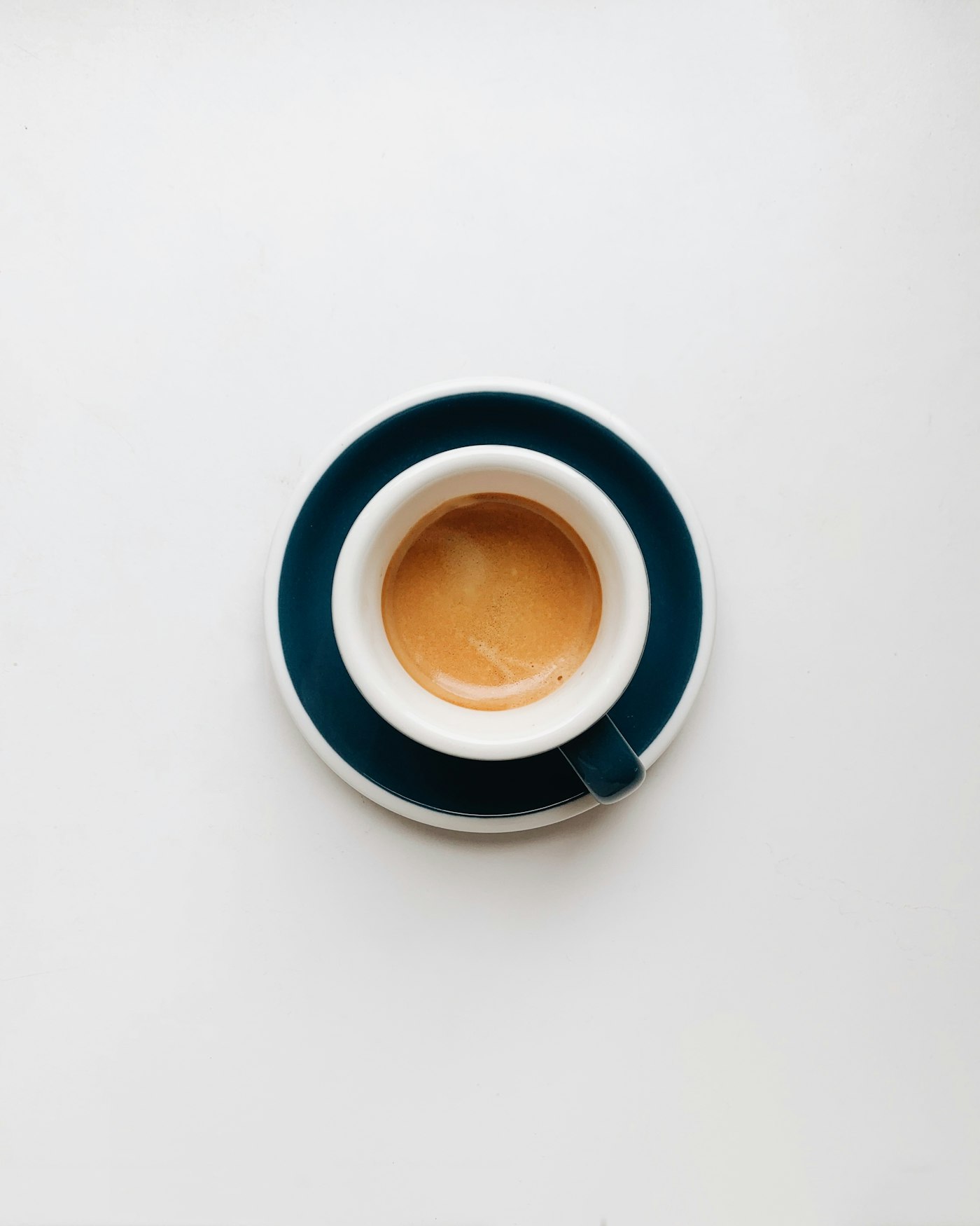 Cup of espresso with crema on a saucer