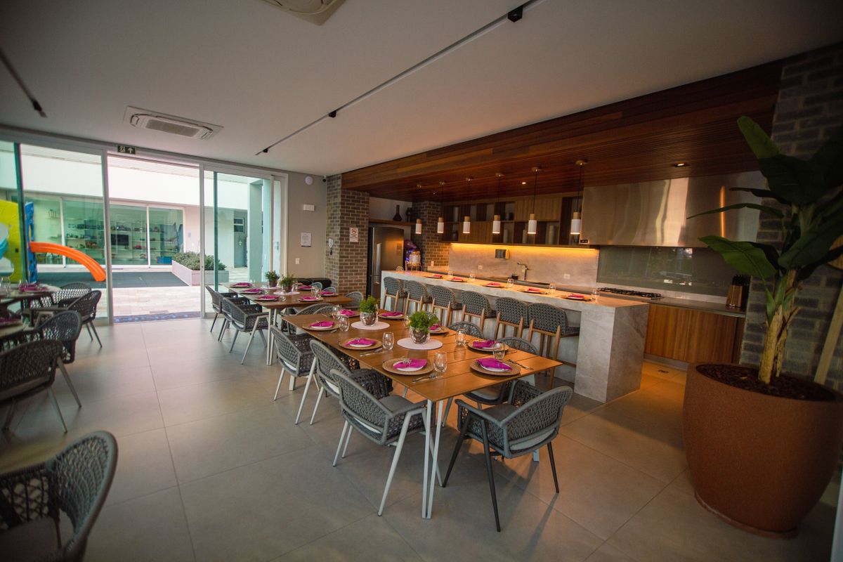 Contemporary restaurant dining room with long rows of tables